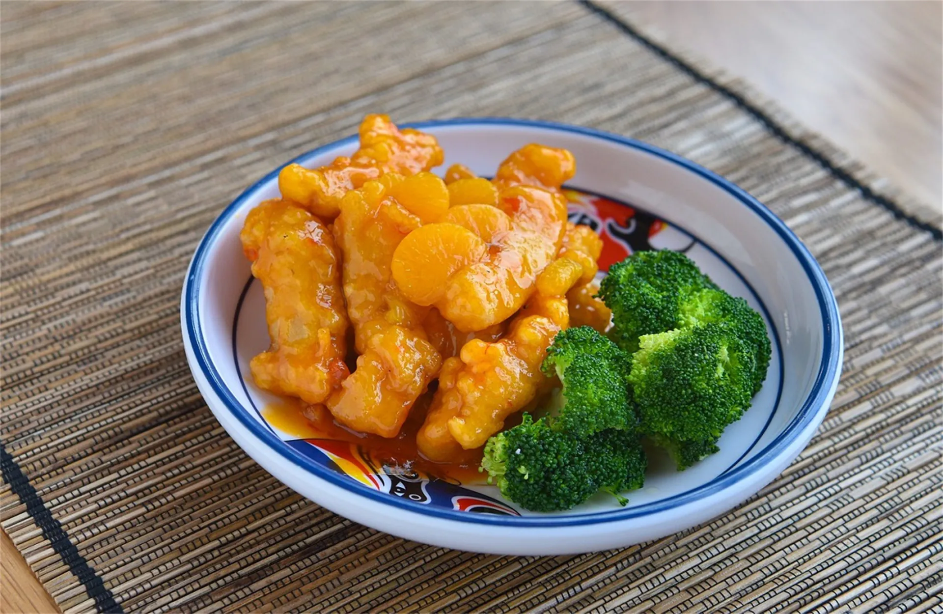 Crispy chicken in sweet orange sauce with broccoli at Mee Shane Restaurant, a Chinese Restaurant in Ashton.